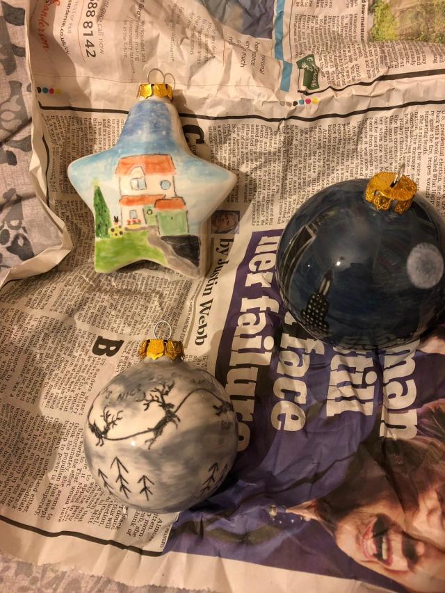 Glazed Christmas baubles painted at Tarka Pottery