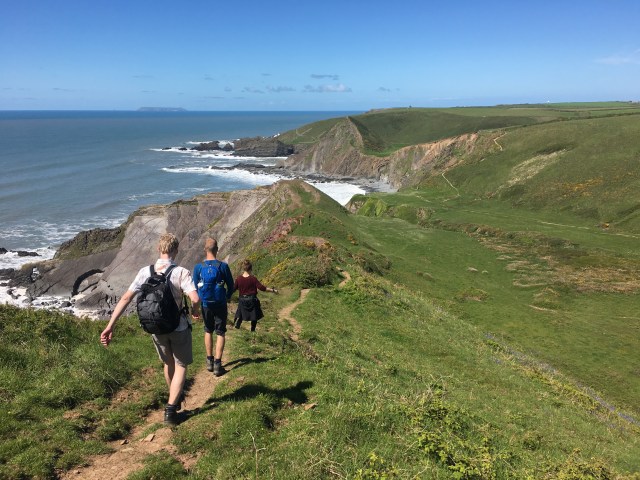 Walking on a steep part of South West Coast Path near Hartland Quay