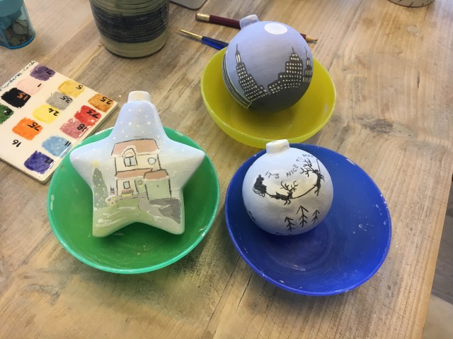 Unglazed painted baubles at Tarka Pottery
