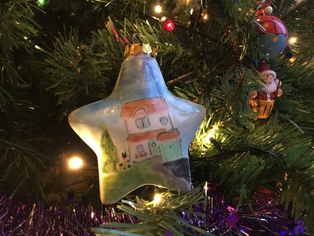 Christmas bauble painted at Tarka Pottery on tree